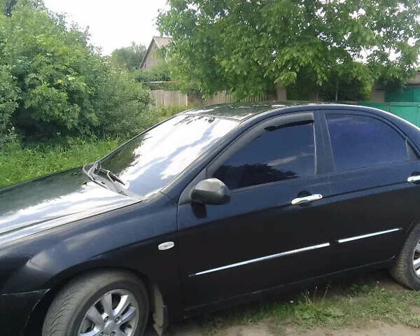Чорний Кіа Черато, об'ємом двигуна 2 л та пробігом 310 тис. км за 4000 $, фото 3 на Automoto.ua