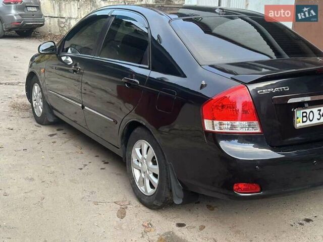 Черный Киа Черато, объемом двигателя 1.6 л и пробегом 230 тыс. км за 4950 $, фото 3 на Automoto.ua