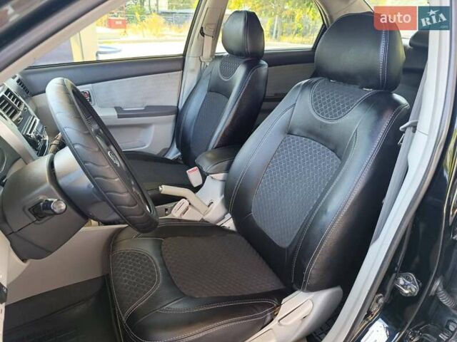 Черный Киа Черато, объемом двигателя 1.59 л и пробегом 219 тыс. км за 4600 $, фото 26 на Automoto.ua