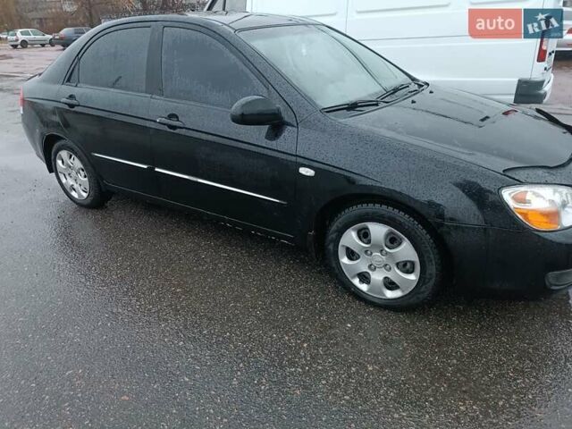 Черный Киа Черато, объемом двигателя 1.6 л и пробегом 260 тыс. км за 5200 $, фото 1 на Automoto.ua