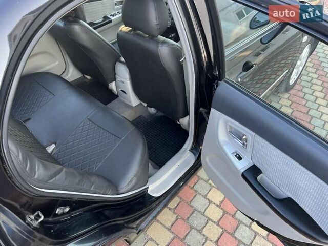 Черный Киа Черато, объемом двигателя 1.6 л и пробегом 208 тыс. км за 3900 $, фото 8 на Automoto.ua