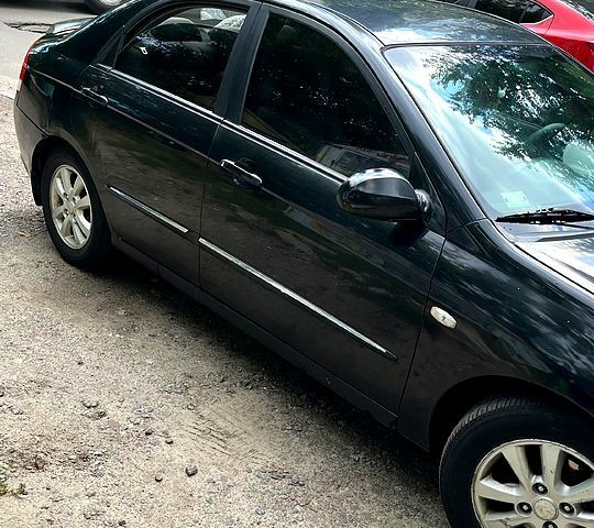 Черный Киа Черато, объемом двигателя 2 л и пробегом 163 тыс. км за 3000 $, фото 1 на Automoto.ua