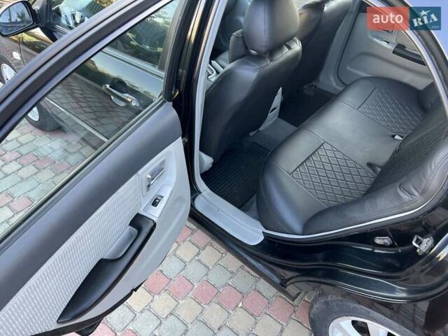 Черный Киа Черато, объемом двигателя 1.6 л и пробегом 208 тыс. км за 3900 $, фото 12 на Automoto.ua