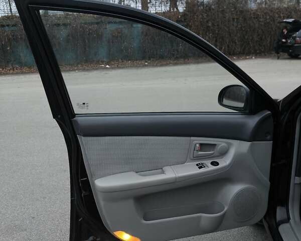 Чорний Кіа Черато, об'ємом двигуна 1.59 л та пробігом 300 тис. км за 4550 $, фото 28 на Automoto.ua