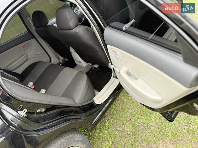 Черный Киа Черато, объемом двигателя 1.59 л и пробегом 312 тыс. км за 3000 $, фото 10 на Automoto.ua