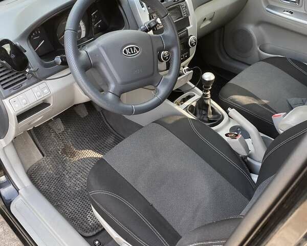 Чорний Кіа Черато, об'ємом двигуна 1.6 л та пробігом 157 тис. км за 5800 $, фото 14 на Automoto.ua