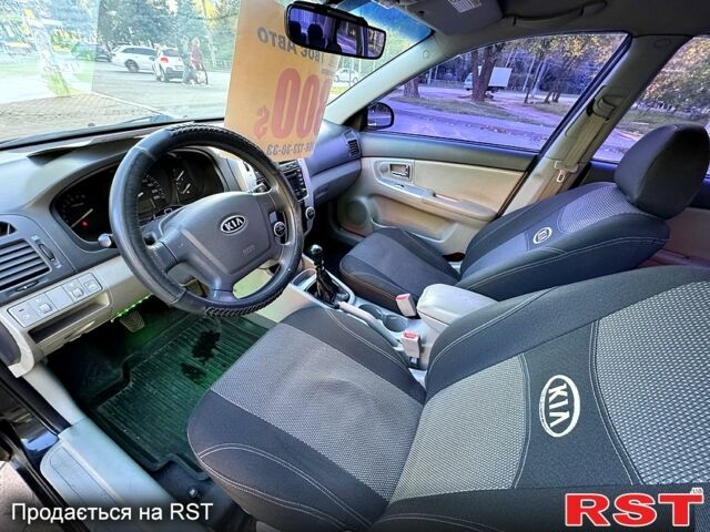 Черный Киа Черато, объемом двигателя 1.6 л и пробегом 174 тыс. км за 4550 $, фото 4 на Automoto.ua