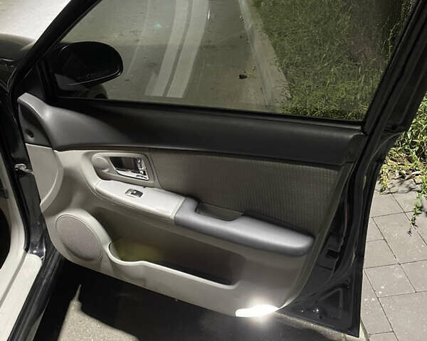 Черный Киа Черато, объемом двигателя 1.98 л и пробегом 315 тыс. км за 5745 $, фото 16 на Automoto.ua