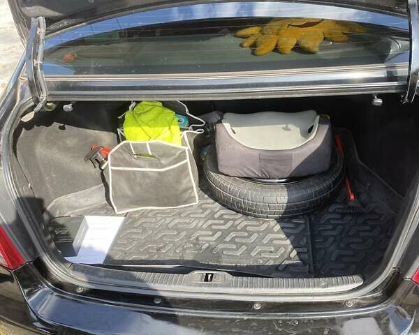 Чорний Кіа Черато, об'ємом двигуна 1.6 л та пробігом 157 тис. км за 5800 $, фото 12 на Automoto.ua