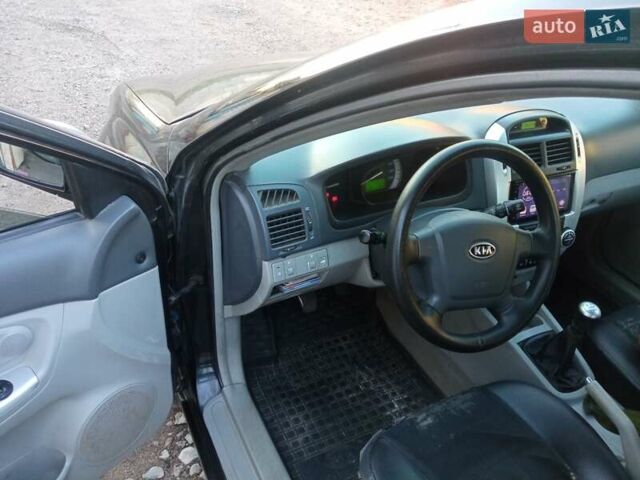 Черный Киа Черато, объемом двигателя 1.6 л и пробегом 228 тыс. км за 4300 $, фото 5 на Automoto.ua