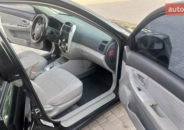 Черный Киа Черато, объемом двигателя 1.98 л и пробегом 268 тыс. км за 5200 $, фото 17 на Automoto.ua