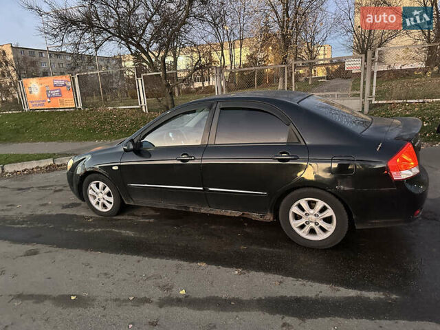 Черный Киа Черато, объемом двигателя 1.6 л и пробегом 294 тыс. км за 3500 $, фото 5 на Automoto.ua