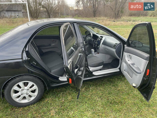 Черный Киа Черато, объемом двигателя 1.98 л и пробегом 315 тыс. км за 5745 $, фото 10 на Automoto.ua