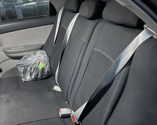 Черный Киа Черато, объемом двигателя 1.59 л и пробегом 273 тыс. км за 4200 $, фото 9 на Automoto.ua