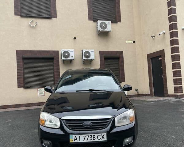 Черный Киа Черато, объемом двигателя 1.59 л и пробегом 210 тыс. км за 3500 $, фото 2 на Automoto.ua