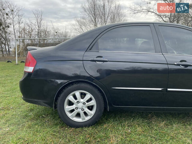 Черный Киа Черато, объемом двигателя 1.98 л и пробегом 315 тыс. км за 5745 $, фото 6 на Automoto.ua