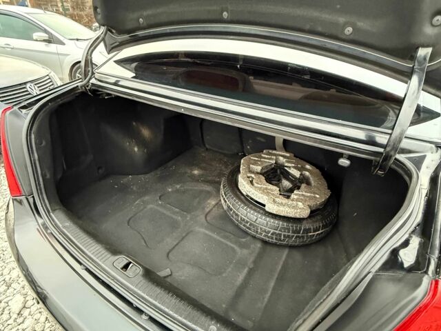 Черный Киа Черато, объемом двигателя 1.6 л и пробегом 258 тыс. км за 5200 $, фото 10 на Automoto.ua