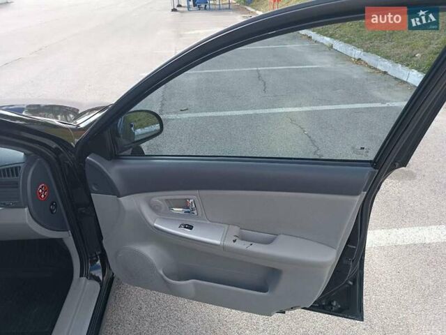 Черный Киа Черато, объемом двигателя 2 л и пробегом 298 тыс. км за 4250 $, фото 14 на Automoto.ua