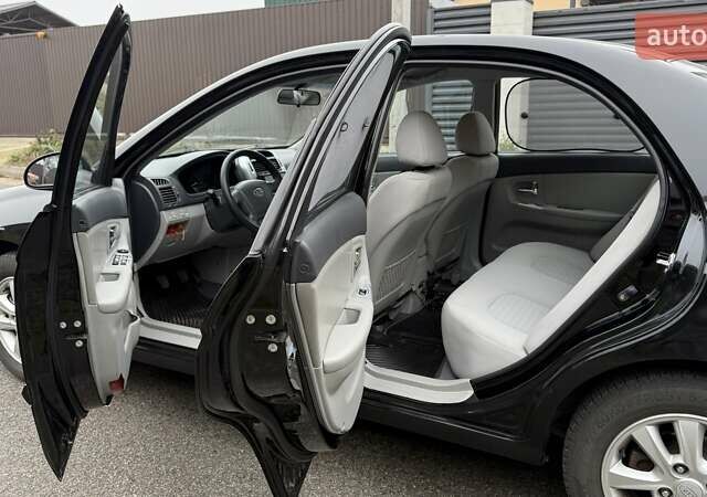 Черный Киа Черато, объемом двигателя 2 л и пробегом 186 тыс. км за 4999 $, фото 2 на Automoto.ua