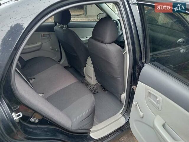 Черный Киа Черато, объемом двигателя 1.6 л и пробегом 260 тыс. км за 3800 $, фото 1 на Automoto.ua