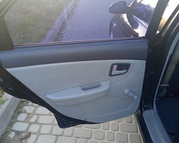 Чорний Кіа Черато, об'ємом двигуна 1.6 л та пробігом 232 тис. км за 4250 $, фото 16 на Automoto.ua