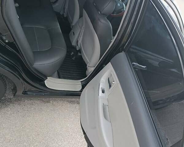 Черный Киа Черато, объемом двигателя 2 л и пробегом 298 тыс. км за 4250 $, фото 2 на Automoto.ua