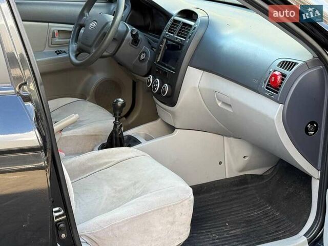 Чорний Кіа Черато, об'ємом двигуна 1.6 л та пробігом 239 тис. км за 5390 $, фото 12 на Automoto.ua