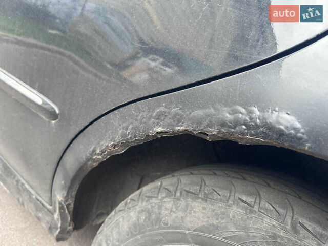 Черный Киа Черато, объемом двигателя 2 л и пробегом 220 тыс. км за 3400 $, фото 11 на Automoto.ua