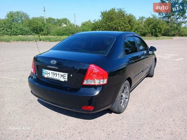 Черный Киа Черато, объемом двигателя 1.6 л и пробегом 225 тыс. км за 5200 $, фото 1 на Automoto.ua
