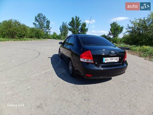 Черный Киа Черато, объемом двигателя 1.6 л и пробегом 225 тыс. км за 5200 $, фото 2 на Automoto.ua