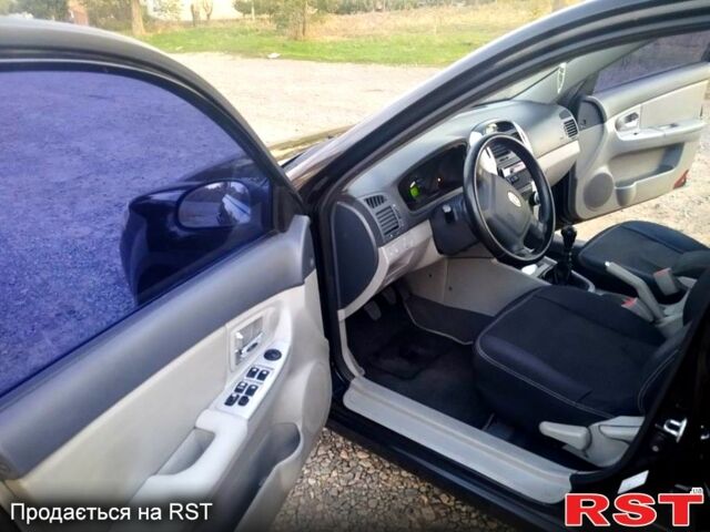 Черный Киа Черато, объемом двигателя 1.6 л и пробегом 272 тыс. км за 4700 $, фото 2 на Automoto.ua