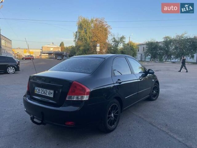 Чорний Кіа Черато, об'ємом двигуна 1.6 л та пробігом 299 тис. км за 4500 $, фото 4 на Automoto.ua
