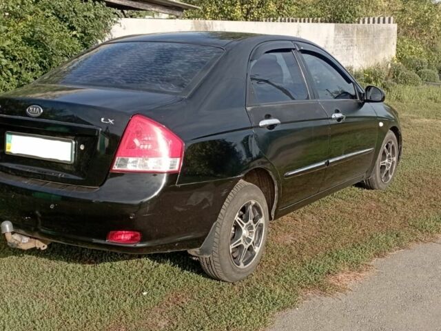 Черный Киа Черато, объемом двигателя 1.6 л и пробегом 380 тыс. км за 3700 $, фото 1 на Automoto.ua