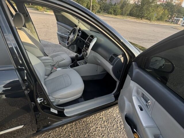 Черный Киа Черато, объемом двигателя 1.6 л и пробегом 156 тыс. км за 5500 $, фото 16 на Automoto.ua