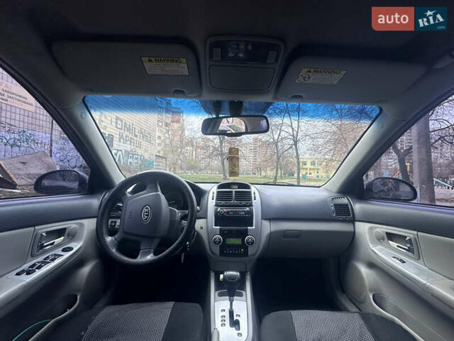 Черный Киа Черато, объемом двигателя 2 л и пробегом 220 тыс. км за 3400 $, фото 4 на Automoto.ua