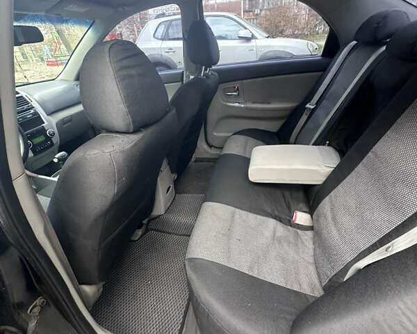 Черный Киа Черато, объемом двигателя 2 л и пробегом 220 тыс. км за 3400 $, фото 3 на Automoto.ua