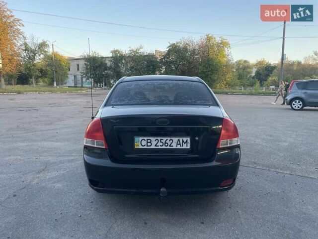 Чорний Кіа Черато, об'ємом двигуна 1.6 л та пробігом 299 тис. км за 4500 $, фото 3 на Automoto.ua