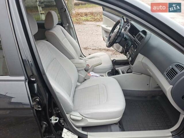 Черный Киа Черато, объемом двигателя 1.6 л и пробегом 225 тыс. км за 5200 $, фото 11 на Automoto.ua