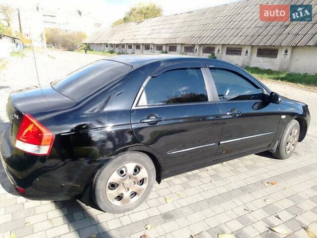Чорний Кіа Черато, об'ємом двигуна 1.6 л та пробігом 335 тис. км за 5500 $, фото 7 на Automoto.ua