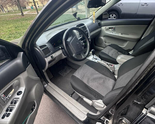 Черный Киа Черато, объемом двигателя 2 л и пробегом 220 тыс. км за 3400 $, фото 5 на Automoto.ua