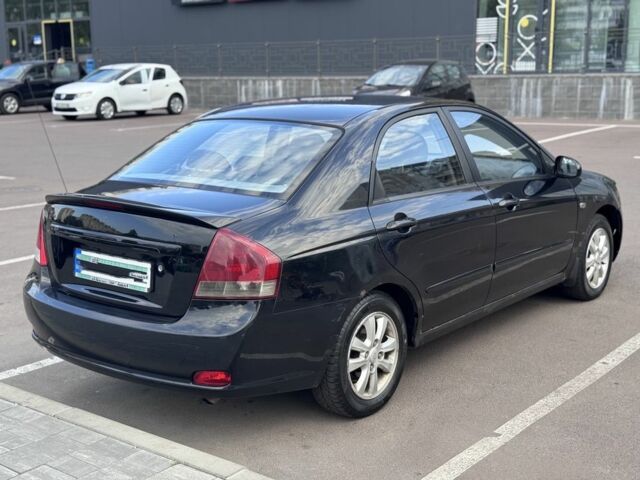 Чорний Кіа Черато, об'ємом двигуна 2 л та пробігом 270 тис. км за 4600 $, фото 2 на Automoto.ua