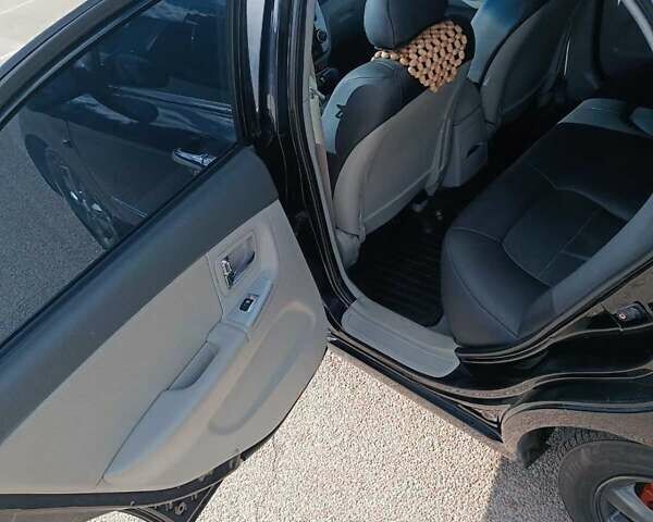 Черный Киа Черато, объемом двигателя 2 л и пробегом 298 тыс. км за 4250 $, фото 15 на Automoto.ua