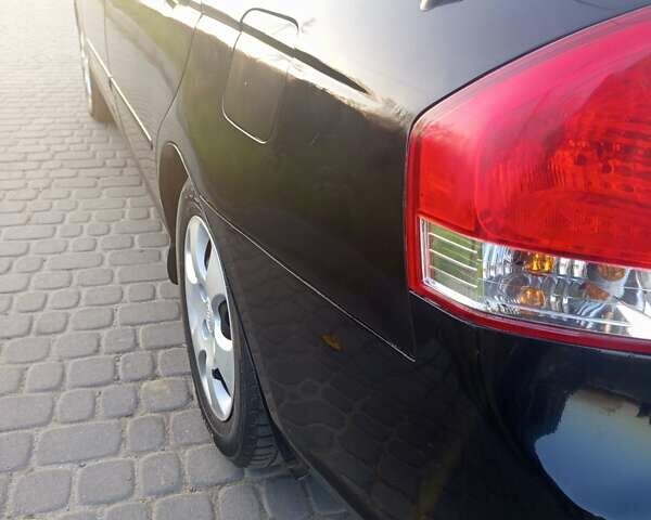 Чорний Кіа Черато, об'ємом двигуна 1.6 л та пробігом 232 тис. км за 4250 $, фото 4 на Automoto.ua