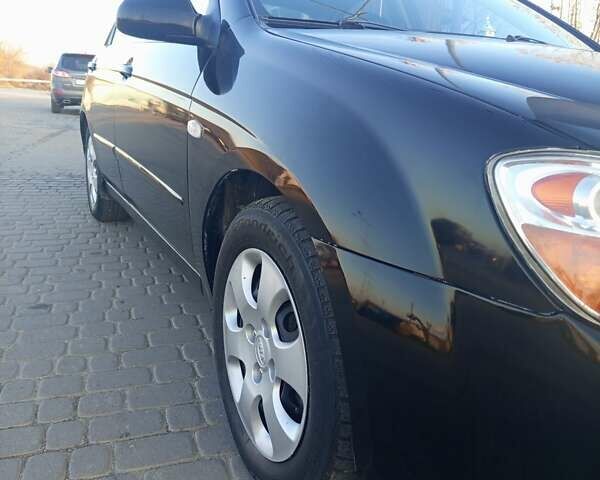 Чорний Кіа Черато, об'ємом двигуна 1.6 л та пробігом 232 тис. км за 4250 $, фото 3 на Automoto.ua