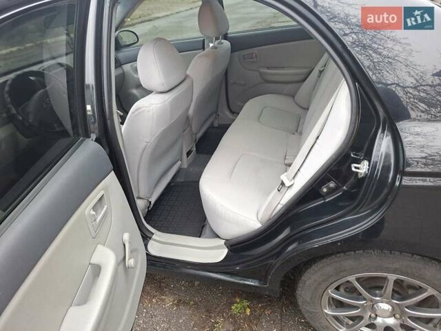 Черный Киа Черато, объемом двигателя 1.6 л и пробегом 225 тыс. км за 5200 $, фото 12 на Automoto.ua