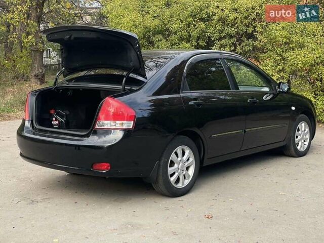 Черный Киа Черато, объемом двигателя 2 л и пробегом 173 тыс. км за 4800 $, фото 10 на Automoto.ua