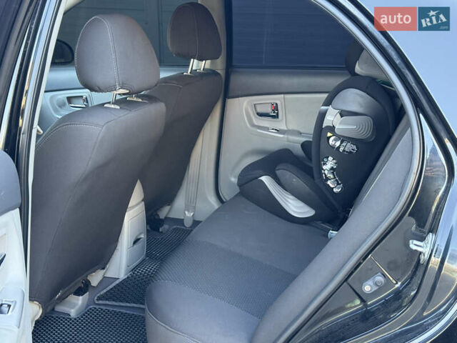 Черный Киа Черато, объемом двигателя 1.98 л и пробегом 180 тыс. км за 5750 $, фото 32 на Automoto.ua