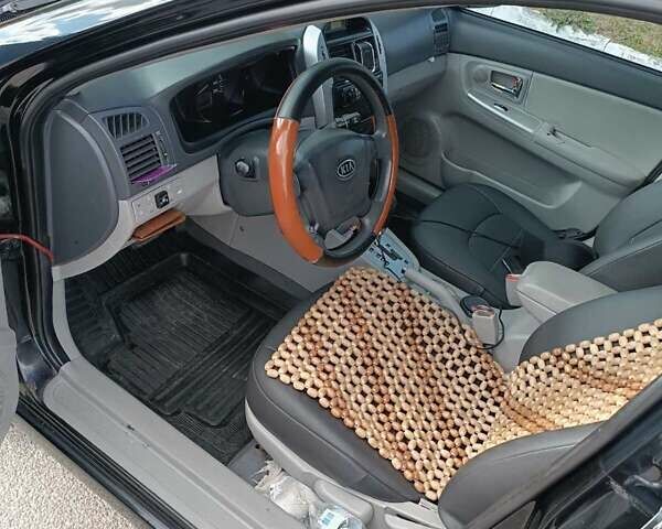 Черный Киа Черато, объемом двигателя 2 л и пробегом 298 тыс. км за 4250 $, фото 13 на Automoto.ua