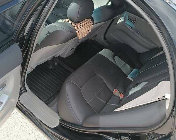 Черный Киа Черато, объемом двигателя 2 л и пробегом 298 тыс. км за 4250 $, фото 12 на Automoto.ua