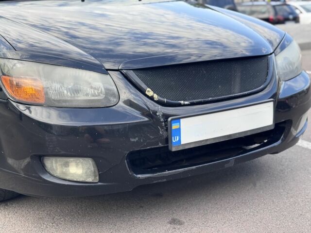 Чорний Кіа Черато, об'ємом двигуна 2 л та пробігом 270 тис. км за 4600 $, фото 21 на Automoto.ua